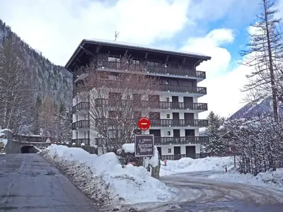 a building on a hill with snow in front of it at Apartment Les Aiguilles du Brévent by Interhome in Chamonix-Mont-Blanc
