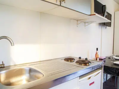 a kitchen with a sink and a counter top at Studio Arve 1 et 2-3 by Interhome in Chamonix-Mont-Blanc