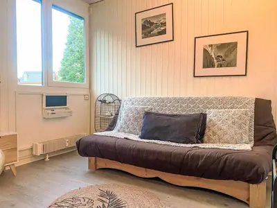 a bedroom with a bed with a pillow on it at Studio Arve 1 et 2-3 by Interhome in Chamonix-Mont-Blanc