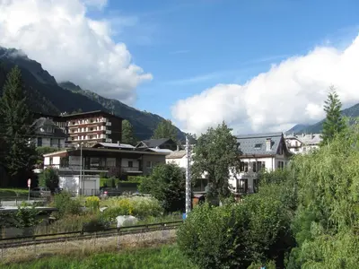 a city with houses and mountains in the background at Studio Arve 1 et 2-3 by Interhome in Chamonix-Mont-Blanc