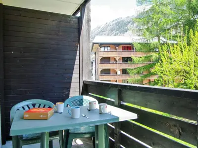 a house in the mountains with snow on the trees at Studio Le Grépon-3 by Interhome in Chamonix-Mont-Blanc