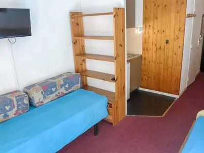 a room with two bunk beds and a tv at Apartment La Forclaz-2 by Interhome in Chamonix-Mont-Blanc