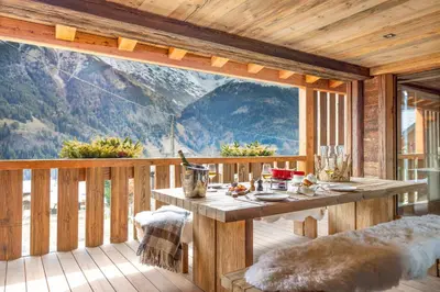 a bathroom with a large bath tub with blue walls at Armancette - The Leading Hotels of the World in Saint-Gervais-les-Bains