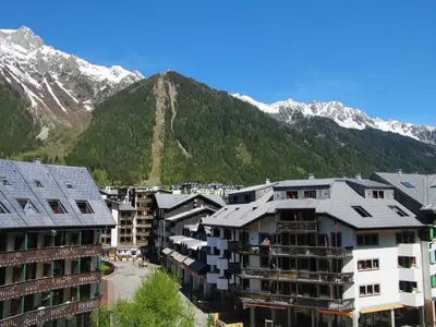 a group of buildings in front of a mountain at Apartment Gentiane-3 by Interhome in Chamonix-Mont-Blanc