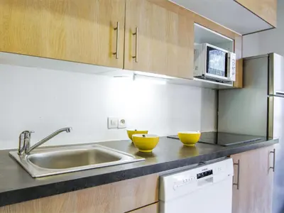 a kitchen with a sink and two bowls on the counter at Apartment Gentiane-3 by Interhome in Chamonix-Mont-Blanc