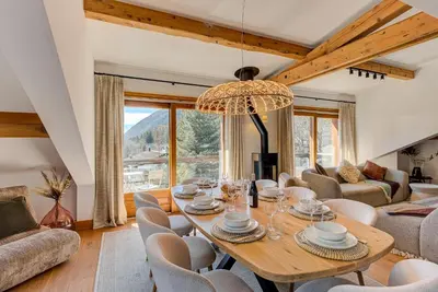 a dining room with a table and chairs at Les Melées Apartments - Alpes Travel - Argentiere in Chamonix-Mont-Blanc