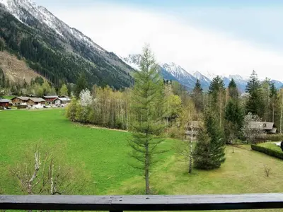 a large building in the middle of a mountain at Apartment Le Bois du Bouchet-7 by Interhome in Chamonix-Mont-Blanc