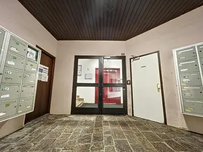 an empty room with a door to a building at Le Caribou in Chamonix-Mont-Blanc