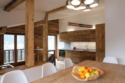 a kitchen with a table with a bowl of fruit at Le Brevent 1 Apartment in Chamonix-Mont-Blanc