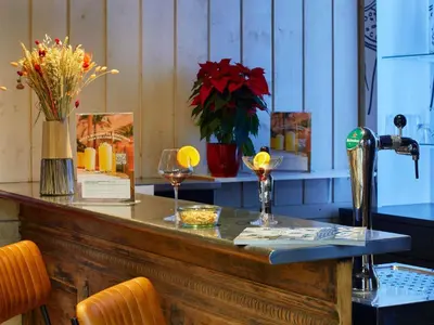 a hotel room with a bed and a table and a chair at Ibis Sallanches Porte du MontBlanc in Sallanches