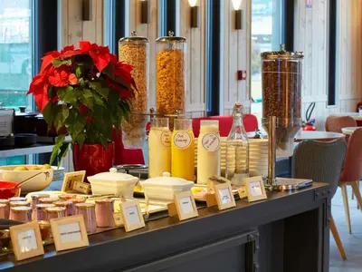 a table with food items on a table at Ibis Sallanches Porte du MontBlanc in Sallanches