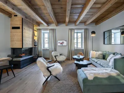 a living room with a couch and a fireplace at Appartement rénové 3 ch, centre Megève, parking, wifi - FR-1-453-178 in Megève