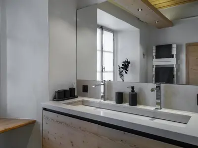 a white bathroom with a sink and a window at Appartement rénové 3 ch, centre Megève, parking, wifi - FR-1-453-178 in Megève