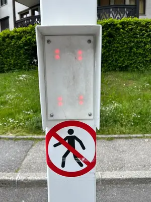 a traffic sign on a pole on a street at Le Balme Studio WiFi/Parking/Balcony in Chamonix-Mont-Blanc
