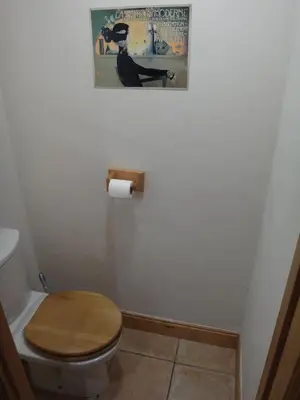 a small room with a door and a tiled floor at Chalet Les Trappeurs in Les Carroz d'Araches
