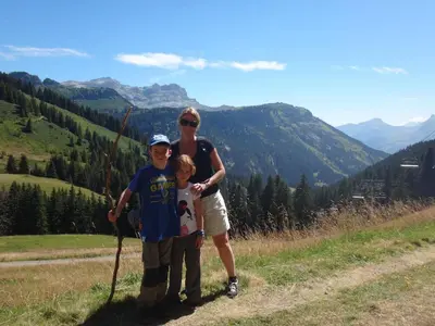 a woman and a child standing on a mountain at Chalet Les Trappeurs in Les Carroz d'Araches
