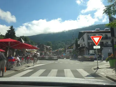 a street with a yield sign in a town at Chalet Les Trappeurs in Les Carroz d'Araches