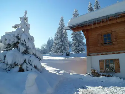 a snow covered cabin with trees in the background at Marie Mont Blanc vue Mont Blanc in Saint-Gervais-les-Bains