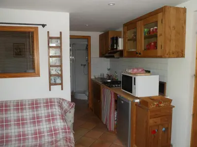 a kitchen with a microwave on top of a counter at Marie Mont Blanc vue Mont Blanc in Saint-Gervais-les-Bains