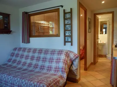 a bedroom with a bed and a bathroom at Marie Mont Blanc vue Mont Blanc in Saint-Gervais-les-Bains