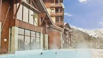 a large brick building with a fire inside of it at Flaine prime ski in, ski out Apartment in Flaine
