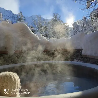 a hot tub covered in snow with snow at Chalet Altitude 1057 in Chamonix-Mont-Blanc