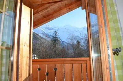 a window in a room with a view of a mountain at Chalet Altitude 1057 in Chamonix-Mont-Blanc