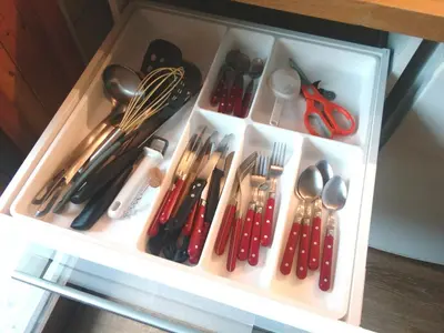 a drawer full of utensils in a drawer at Studio Les Drus / Studio du Brévent in Chamonix-Mont-Blanc