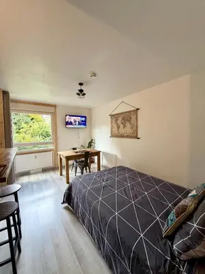 a bedroom with a bed and a desk in it at L'Ècrin Alpin in Saint-Gervais-les-Bains