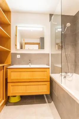 a bathroom with a sink and a shower at Apt. Grand Paradis B14 - Modern with Mont Blanc view in Chamonix-Mont-Blanc