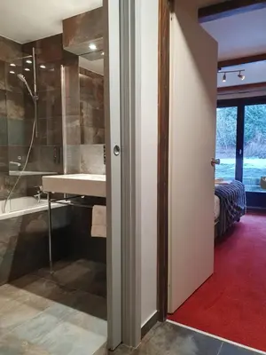 a bathroom with a shower and a sink at Chalet Hôtel du Bois in Les Houches