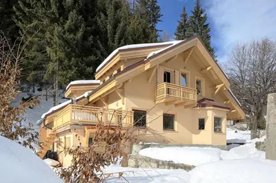 a house in the snow with snow on the ground at 
