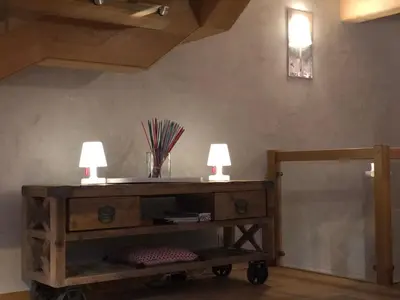 two lamps on a wooden cart in a room at 