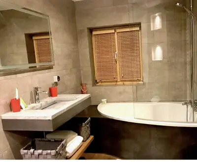 a bathroom with a large sink and a tub at 