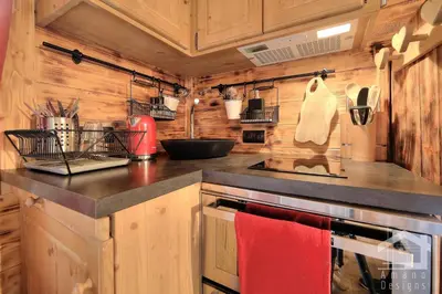 a kitchen with wooden walls and a counter top at 