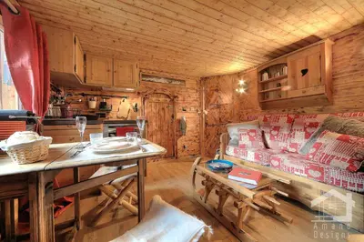 a living room with a couch and a table in a cabin at 