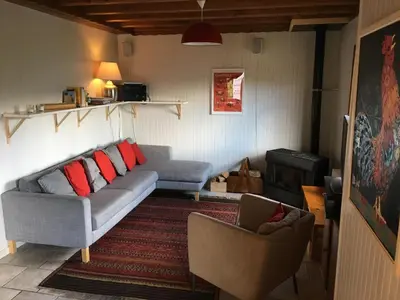 a living room with a couch and a chair at Chalet du Meilly in Saint-Gervais-les-Bains