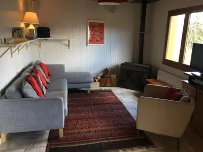 a living room with two couches and a fireplace at Chalet du Meilly in Saint-Gervais-les-Bains