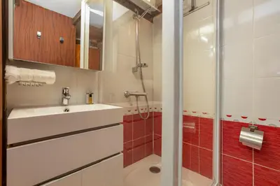 a bathroom with a sink and a shower at Résidence Grand Roc - Bruyères 441 - Happy Rentals in Chamonix-Mont-Blanc