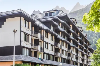 a building in front of a snowy mountain at Résidence Pierre & Vacances Le Chamois Blanc in Chamonix-Mont-Blanc