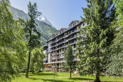 a hotel in the mountains with trees at Résidence Pierre & Vacances Le Chamois Blanc in Chamonix-Mont-Blanc