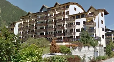 a large building with balconies on the side of it at Appt 4 /5 pers - 3 min. centre ville in Chamonix-Mont-Blanc