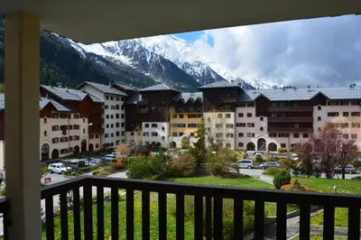 a view from a balcony of a resort with a mountain at Appt 4 /5 pers - 3 min. centre ville in Chamonix-Mont-Blanc
