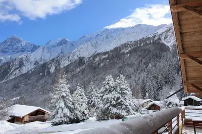 a view of a snowy mountain from a cabin at chalet des grands bois in Les Houches