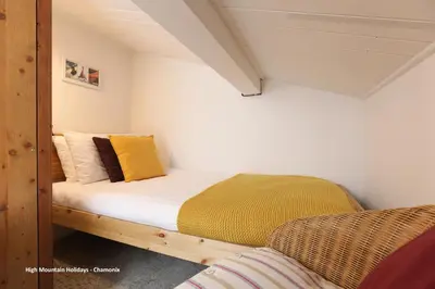a small bedroom with a bed in a attic at Apartment Chloe in Chamonix-Mont-Blanc