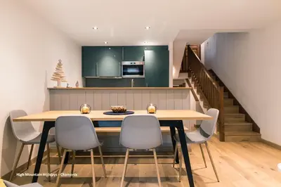 a kitchen and dining room with a table and chairs at Apartment Chloe in Chamonix-Mont-Blanc