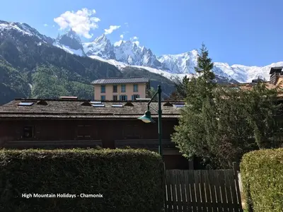 a view of the mountains from the roof of a house at Apartment Chloe in Chamonix-Mont-Blanc