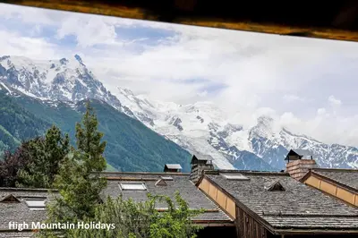 a view of a snowy mountain range with buildings at Apartment Chloe in Chamonix-Mont-Blanc
