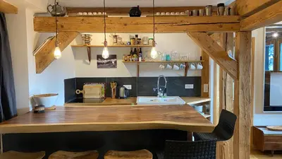 a kitchen with a wooden counter and a sink at Beautiful apartment in Chamonix centre with superb mountain views in Chamonix-Mont-Blanc