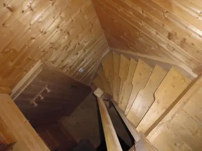 a bedroom with a bed in a log cabin at Chambres et Mazots du Chalet de Mado in Megève